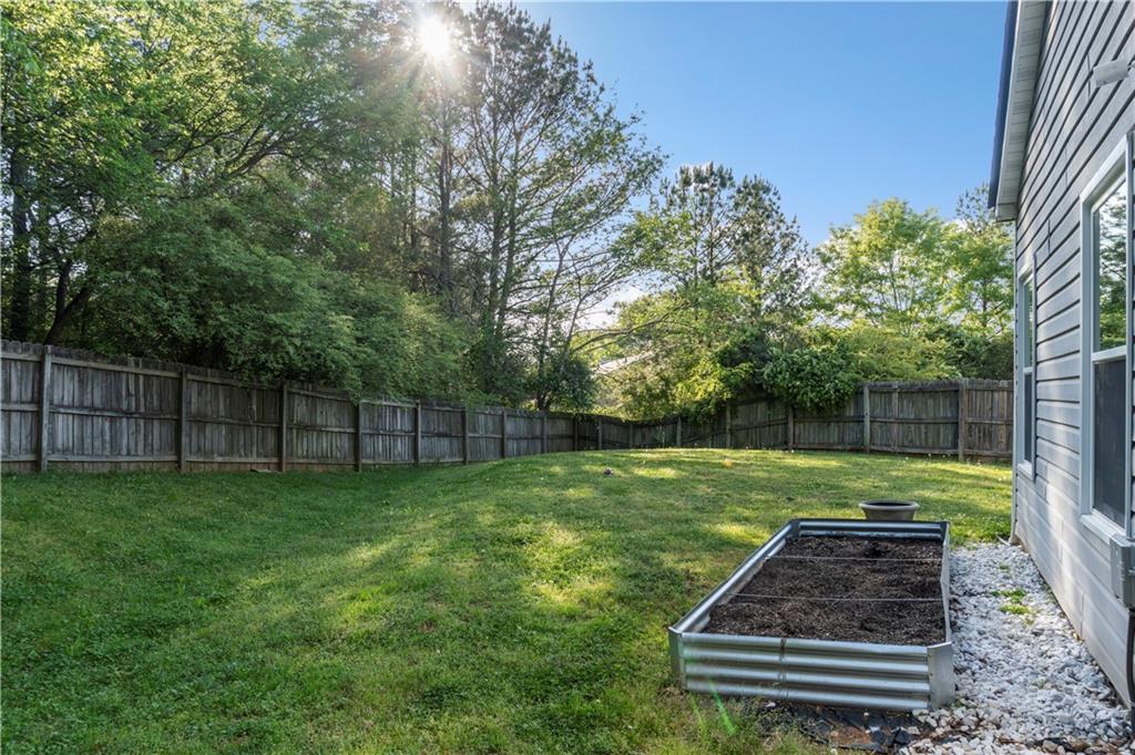 48 Hampton Drive Cartersville, GA 30121 - Photo 25 of 29 a view of a backyard with a garden