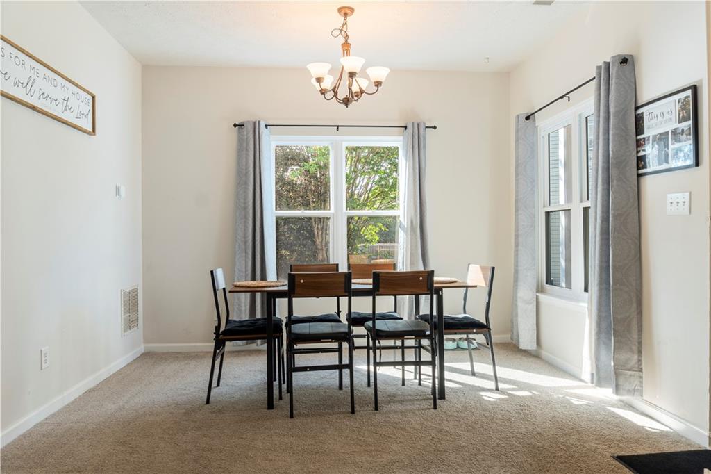 48 Hampton Drive Cartersville, GA 30121 - Photo 3 of 29 a view of a dining room with furniture window and outside view