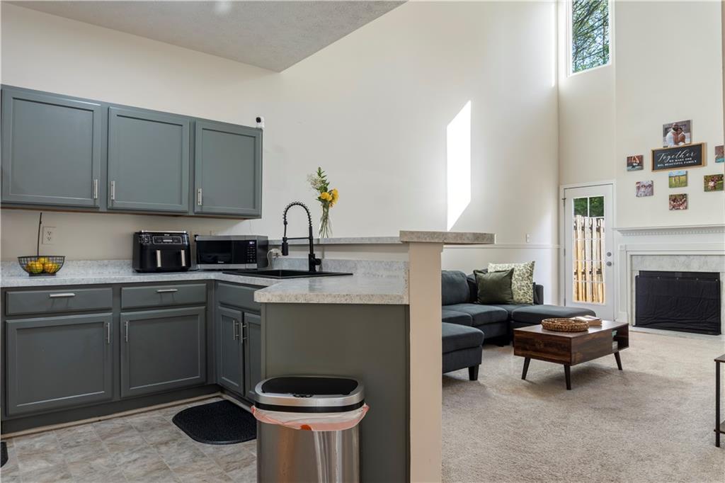 48 Hampton Drive Cartersville, GA 30121 - Photo 5 of 29 a kitchen with a sink cabinets and window