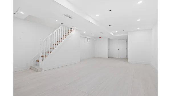 a bathroom with a toilet a sink and a mirror