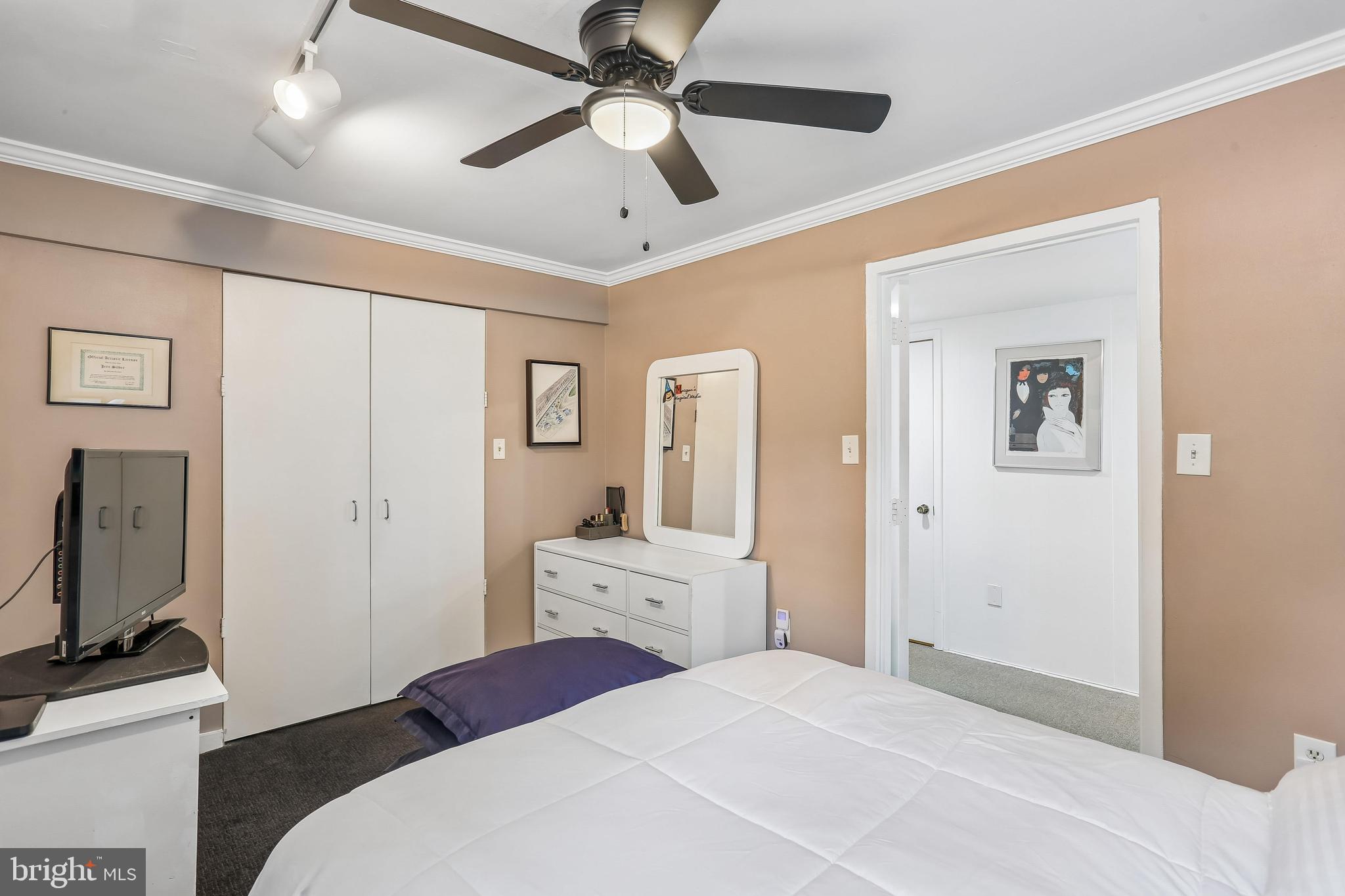 2 Foxhall Court Silver Spring, MD 20906 - Photo 58 of 86 a bedroom with a large bed and a flat tv screen