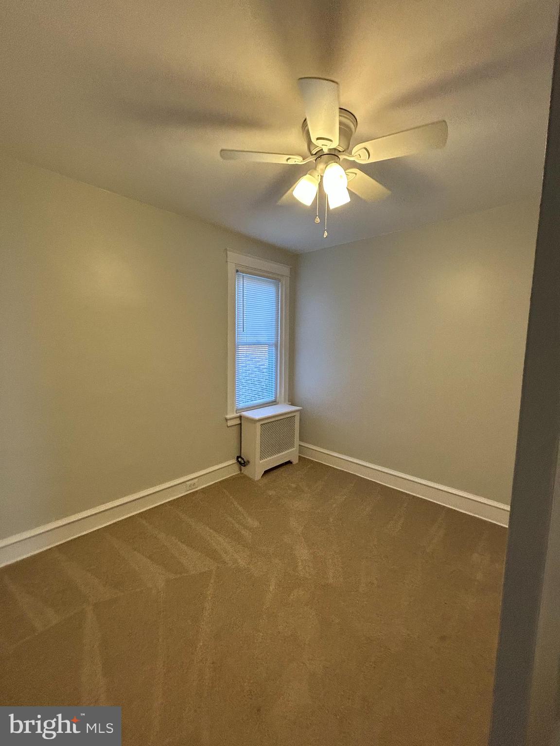 46 Lamport Road Upper Darby, PA 19082 - Photo 21 of 33 an empty room with a window and a fan