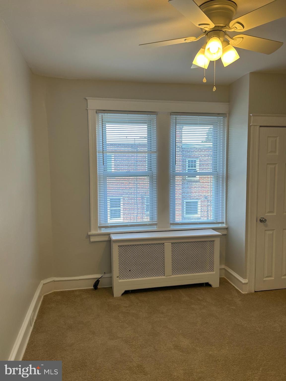 46 Lamport Road Upper Darby, PA 19082 - Photo 22 of 33 an empty room with windows and chandelier fan