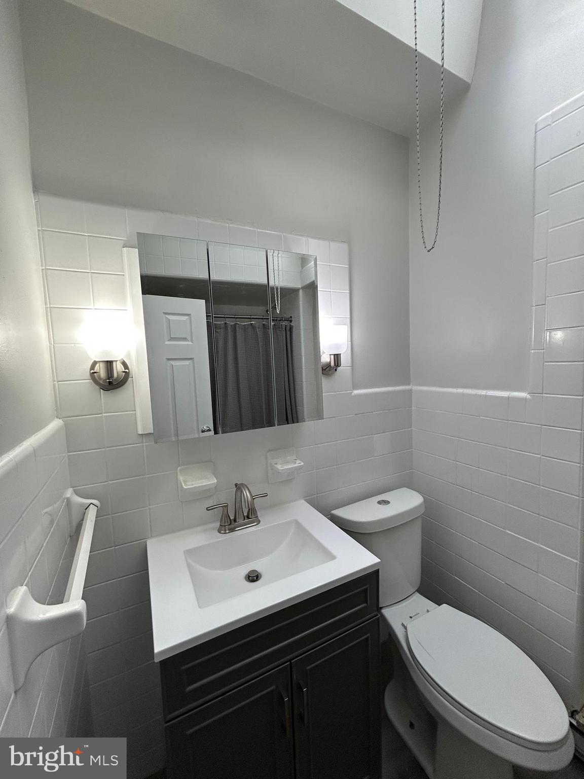46 Lamport Road Upper Darby, PA 19082 - Photo 26 of 33 a bathroom with a toilet a sink and mirror