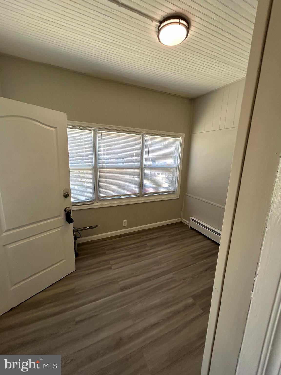 46 Lamport Road Upper Darby, PA 19082 - Photo 7 of 33 a view of empty room with wooden floor and fan