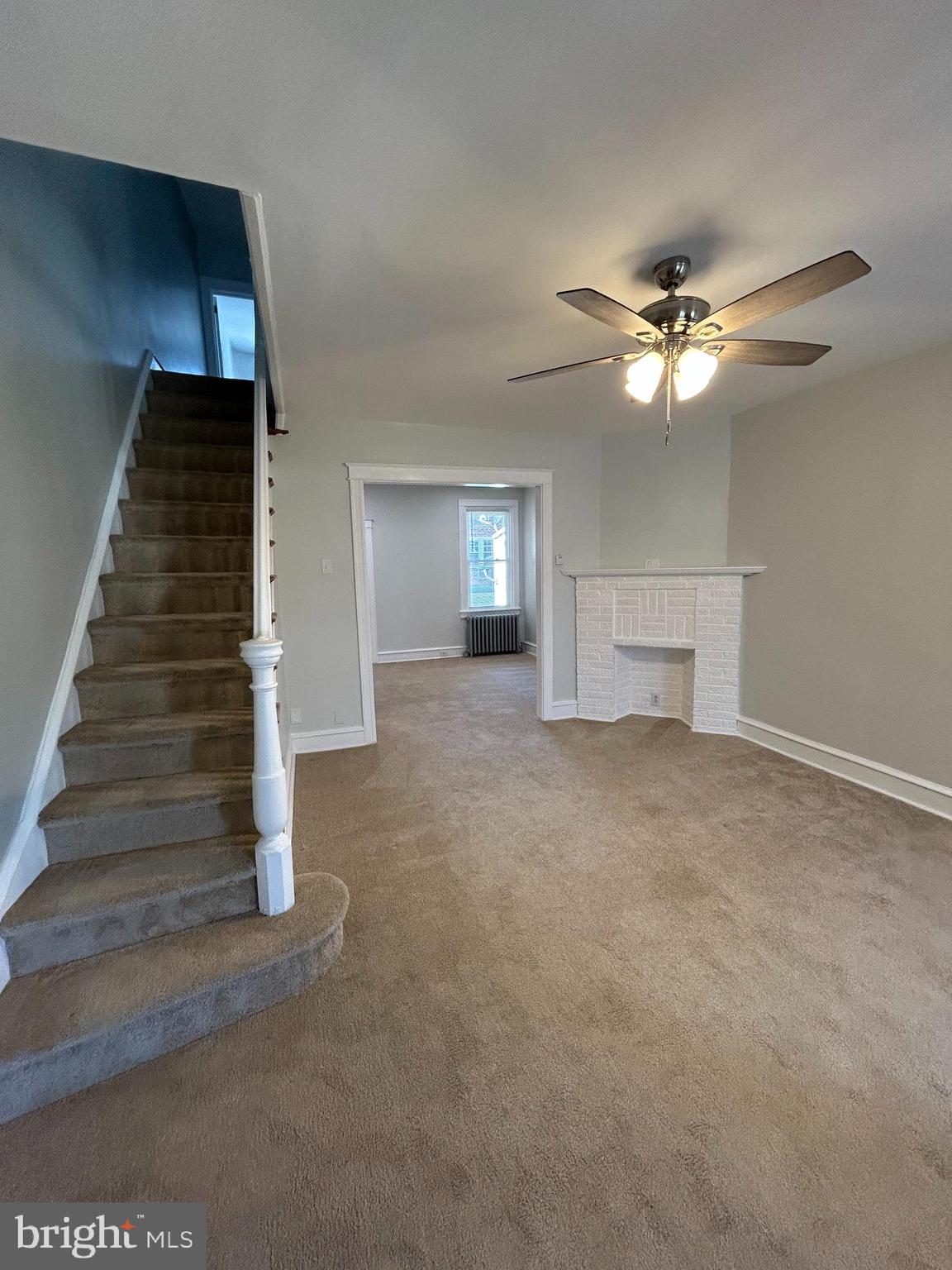 46 Lamport Road Upper Darby, PA 19082 - Photo 10 of 33 a view of empty room with stairs and fan