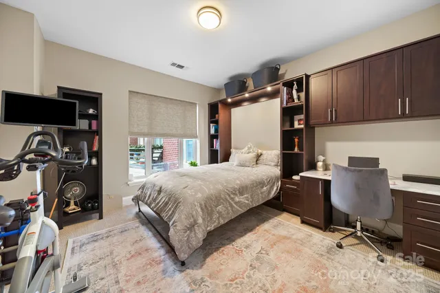 a bedroom with a bed and a chair