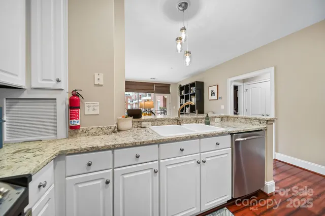 a kitchen with granite countertop cabinets and sink