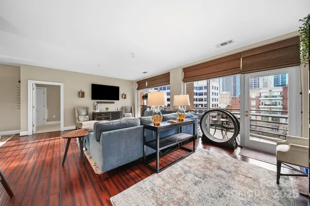 a view of a livingroom with furniture and a window