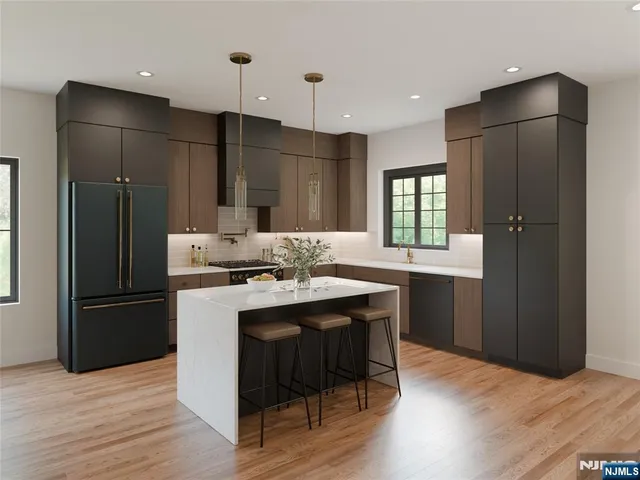 a kitchen with kitchen island white cabinets and stainless steel appliances