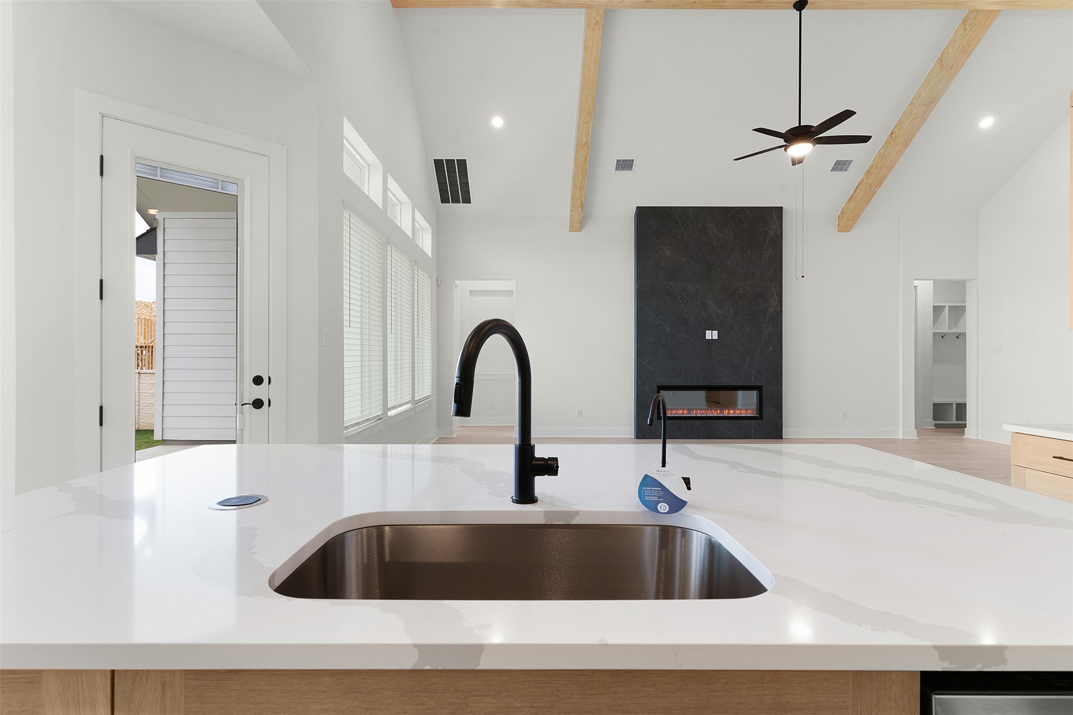17316 Hope Bergman Road Pflugerville, TX 78660 - Photo 15 of 39 a close view of a sink and dishwasher with kitchen island