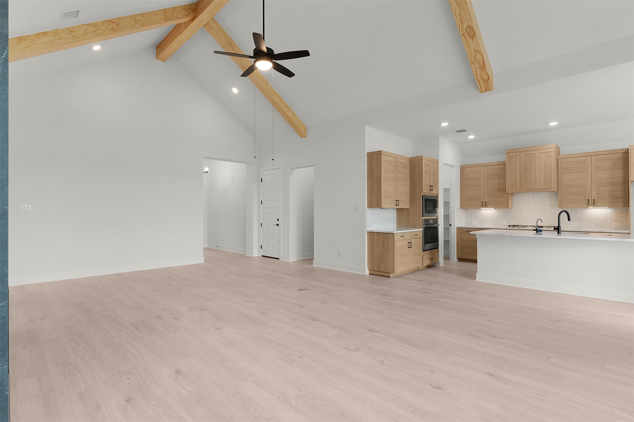 17316 Hope Bergman Road Pflugerville, TX 78660 - Photo 17 of 39 a view of a kitchen with a sink and cabinets