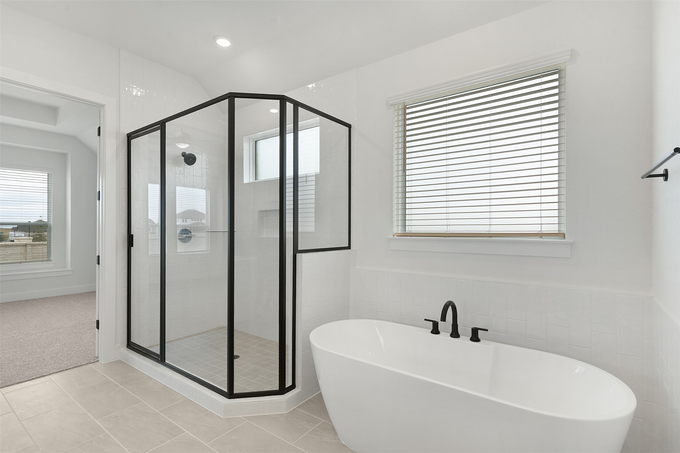 17316 Hope Bergman Road Pflugerville, TX 78660 - Photo 22 of 39 a bathroom with a bathtub and a shower