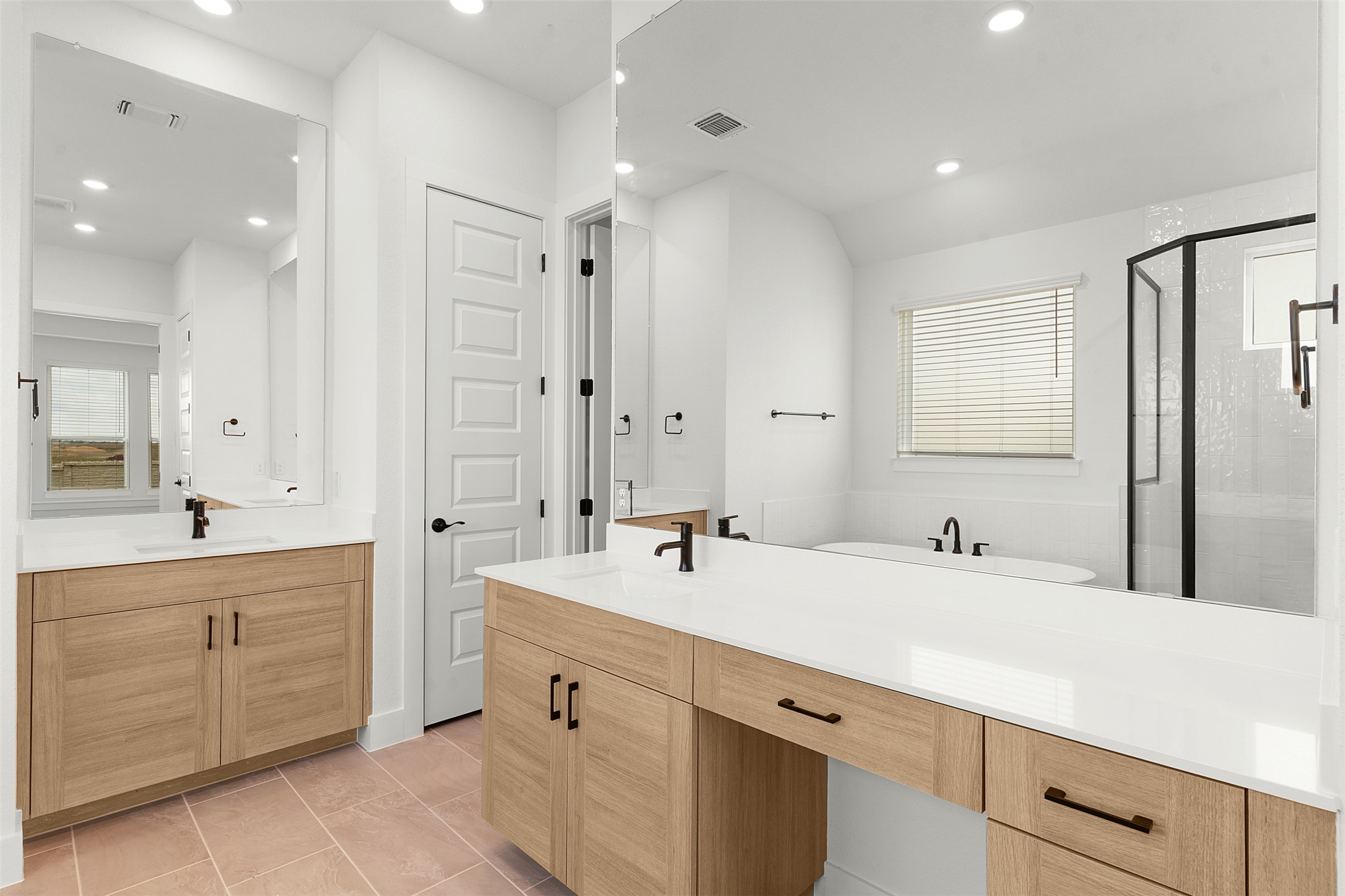 17316 Hope Bergman Road Pflugerville, TX 78660 - Photo 23 of 39 Full bath with a shower stall, two vanities, light tile patterned flooring, and recessed lighting