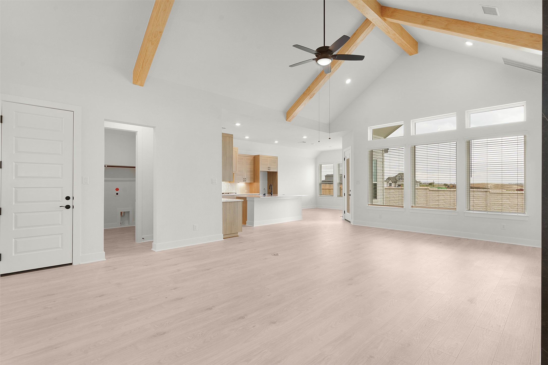 17316 Hope Bergman Road Pflugerville, TX 78660 - Photo 10 of 39 an empty room with large windows and a ceiling fan