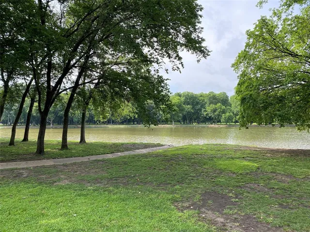 a view of park with green space and trees