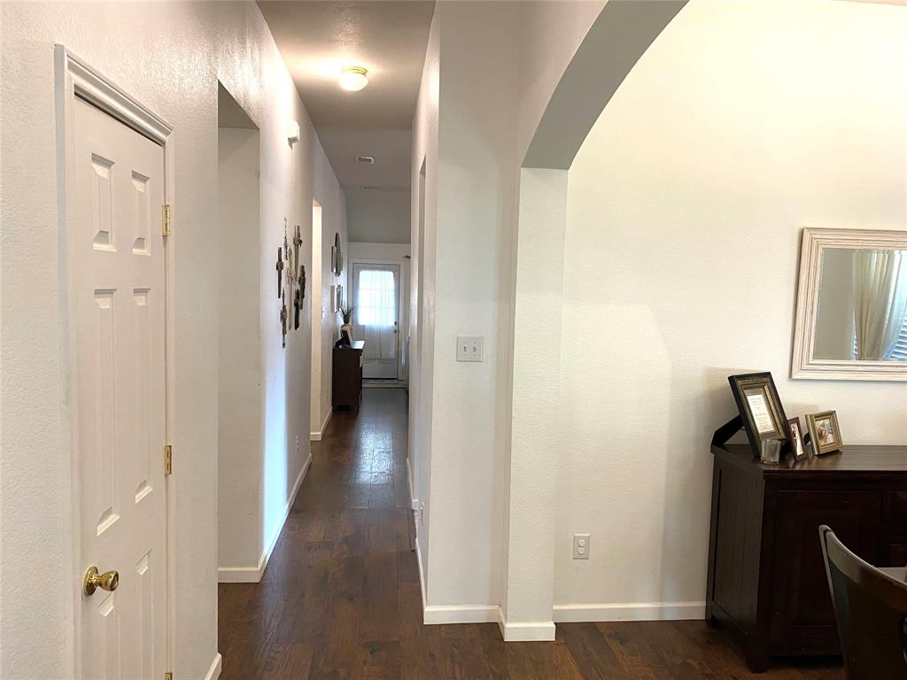 1100 Baker Street McKinney, TX 75069 - Photo 2 of 18 a view of a hallway with wooden floor