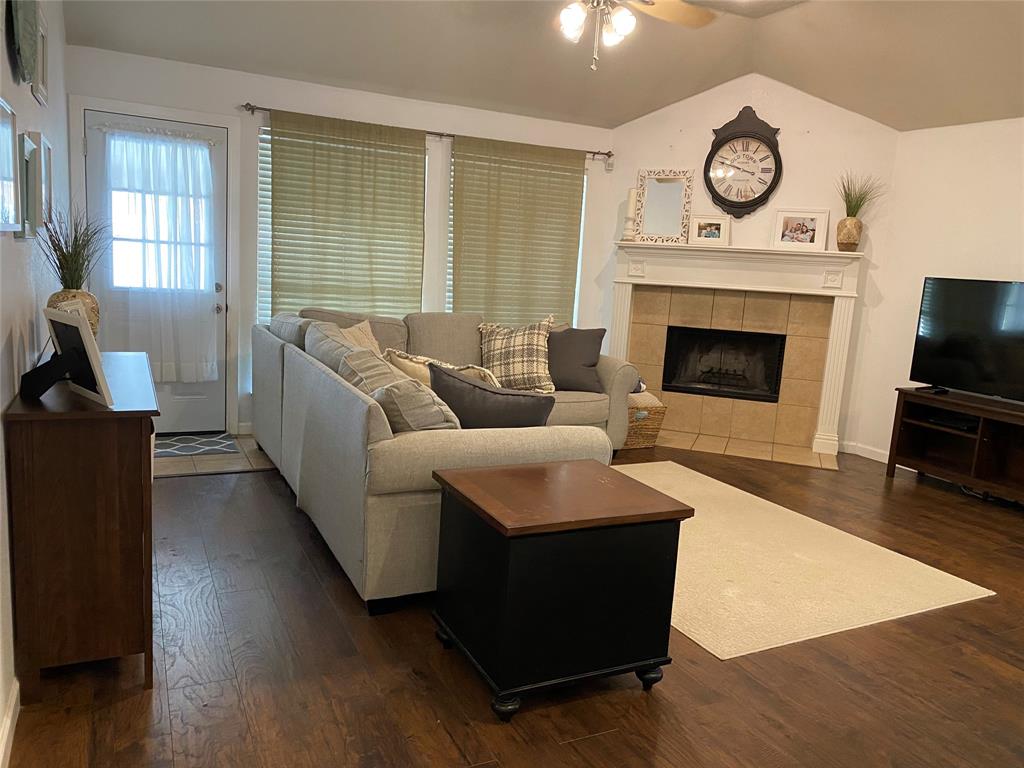 1100 Baker Street McKinney, TX 75069 - Photo 7 of 18 a living room with furniture and a fireplace