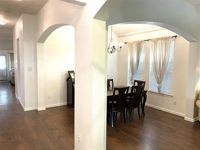 a view of a dining room with furniture and window