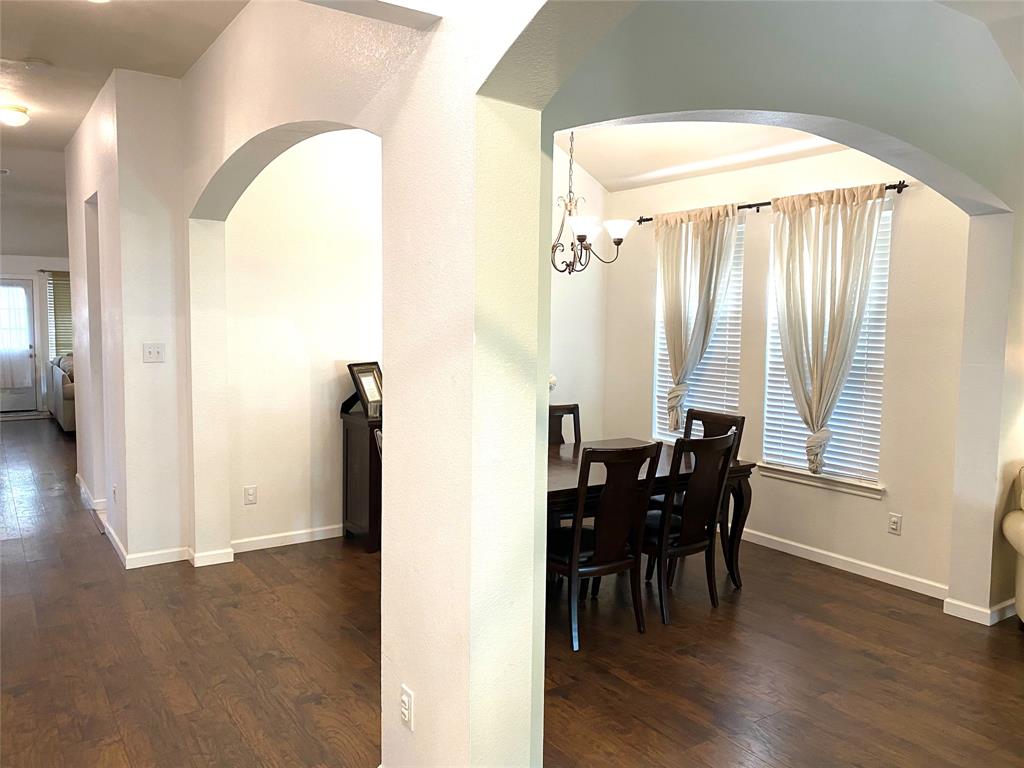 1100 Baker Street McKinney, TX 75069 - Photo 8 of 18 a view of a dining room with furniture and window