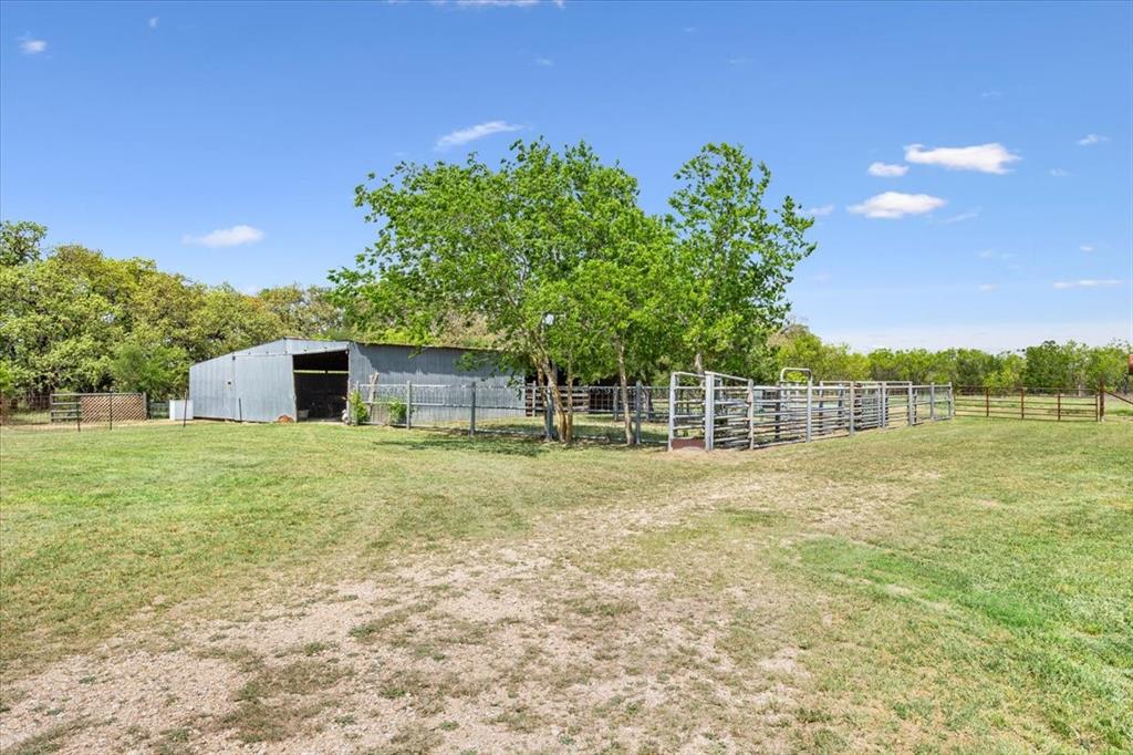 3356 Kattner Road Riesel, TX 76682 - Photo 31 of 40 View of yard with a pole building, an outbuilding, and fence