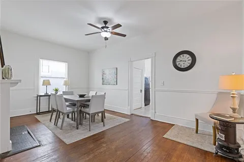 a view of a dining room with furniture and wooden floor