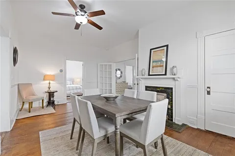 a view of a dining room with furniture and wooden floor