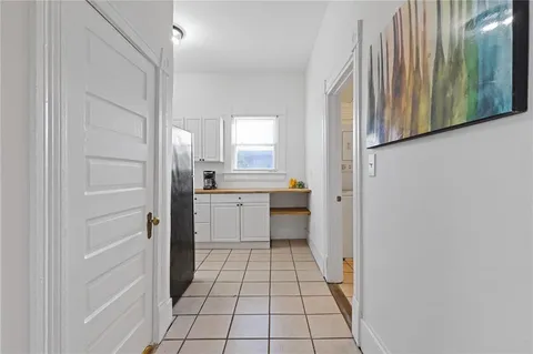 a bathroom with a sink a mirror and a shower