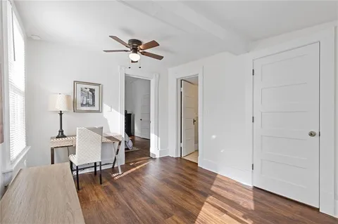 a view of a livingroom with furniture and wooden floor