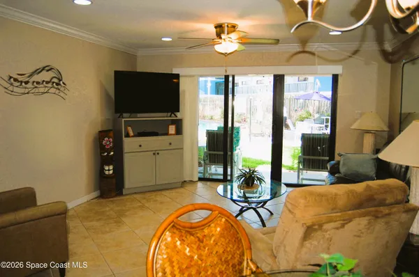 a bedroom with furniture and a flat screen tv