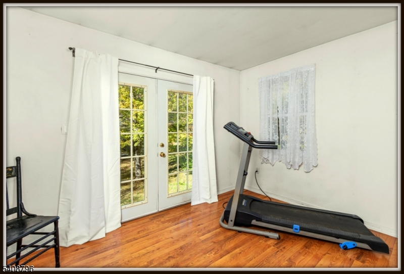3 Sleepy Hollow Road Newton, NJ 07860 - Photo 14 of 25 a room with gym equipment and a window