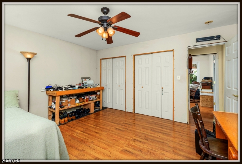 3 Sleepy Hollow Road Newton, NJ 07860 - Photo 16 of 25 a bedroom with a bed and a chandelier