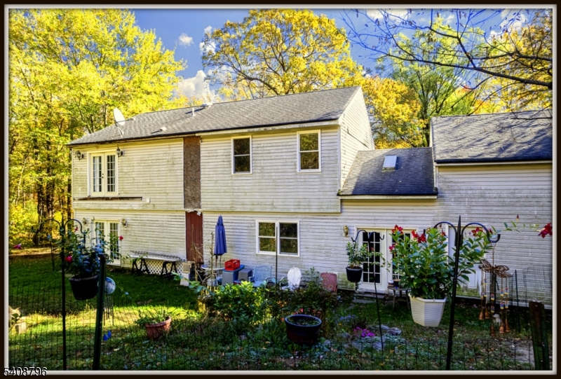 3 Sleepy Hollow Road Newton, NJ 07860 - Photo 19 of 25 a front view of a house with a yard and potted plants