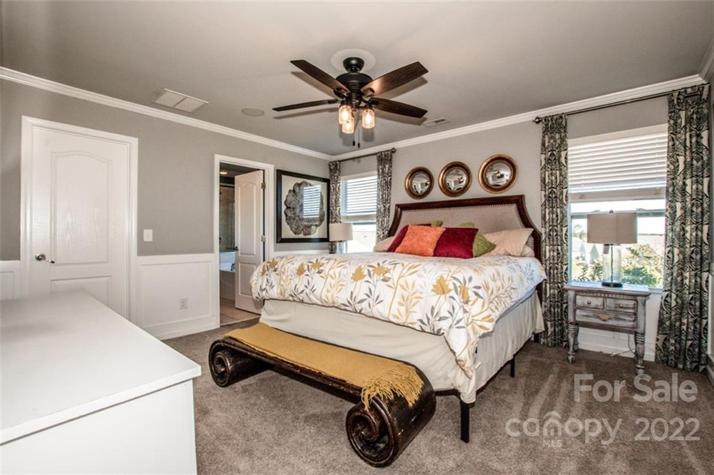 107 East Neel Ranch Road Mooresville, NC 28115 - Photo 24 of 48 a bedroom with a bed and a large window