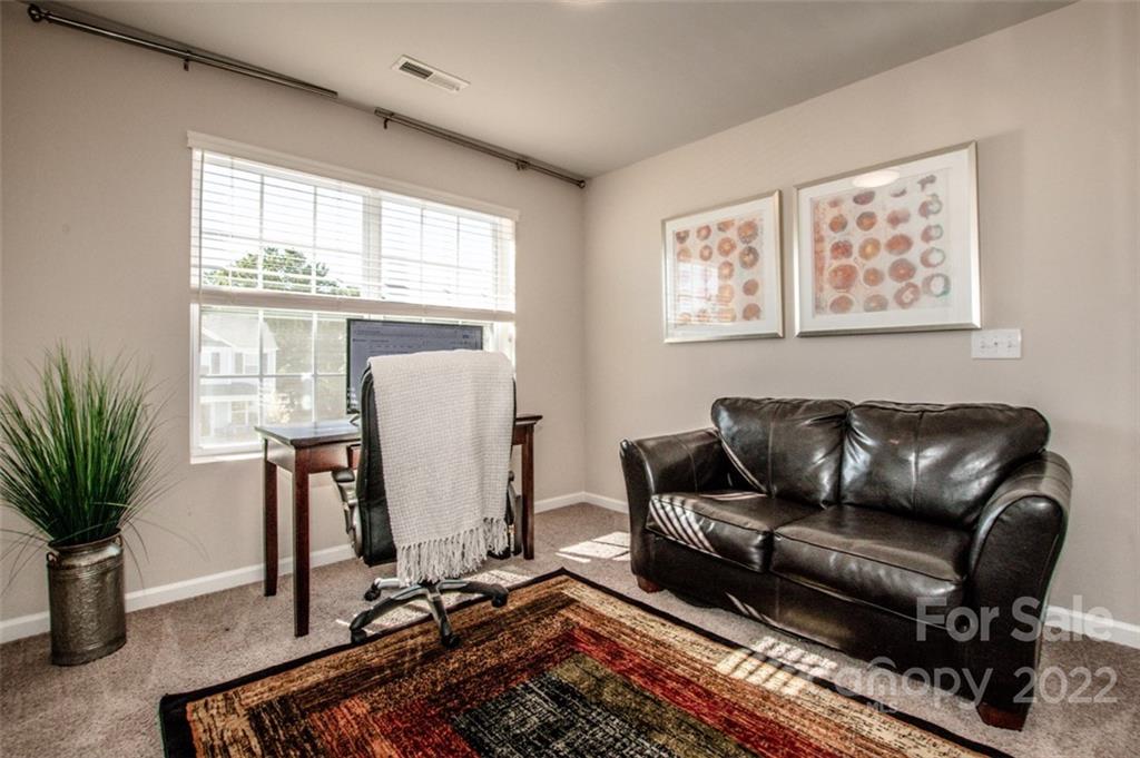 107 East Neel Ranch Road Mooresville, NC 28115 - Photo 34 of 48 a living room with furniture windows and wooden floor