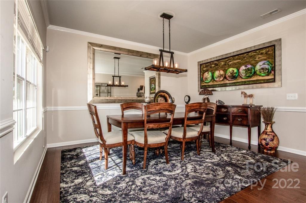 107 East Neel Ranch Road Mooresville, NC 28115 - Photo 5 of 48 a view of a dining room with furniture window and wooden floor