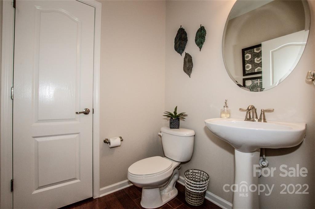 107 East Neel Ranch Road Mooresville, NC 28115 - Photo 6 of 48 a bathroom with a toilet sink and mirror