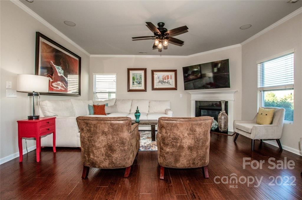 107 East Neel Ranch Road Mooresville, NC 28115 - Photo 8 of 48 a living room with furniture and a fireplace