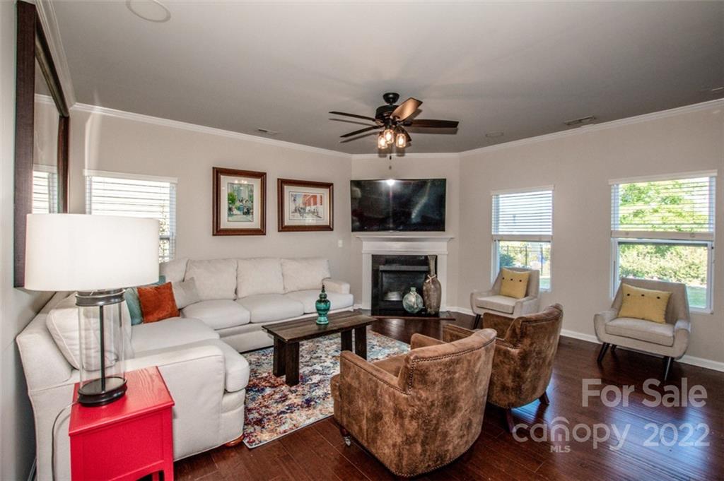107 East Neel Ranch Road Mooresville, NC 28115 - Photo 10 of 48 a living room with furniture and a fireplace