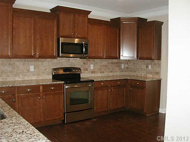 79115 Ridgehaven Road, Unit 161 Lancaster, SC 29720 - Photo 2 of 8 a kitchen with a sink stove and microwave