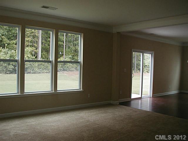 79115 Ridgehaven Road, Unit 161 Lancaster, SC 29720 - Photo 5 of 8 a view of an empty room with a window