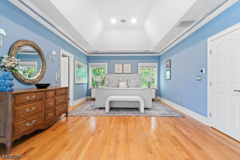 99 East Lindsley Road Cedar Grove, NJ 07009 - Photo 21 of 41 a spacious bedroom with a bed and a large window