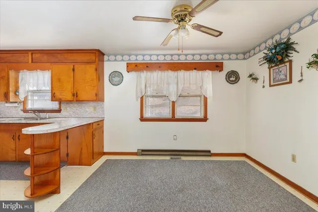 a kitchen with stainless steel appliances granite countertop a sink a stove and a microwave