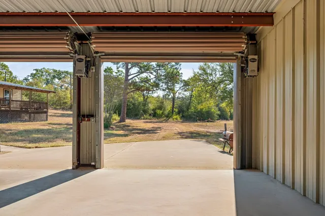 a view of a room with wooden floor and a fireplace