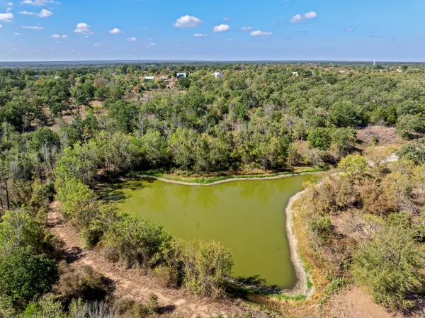 a view of a lake with a yard
