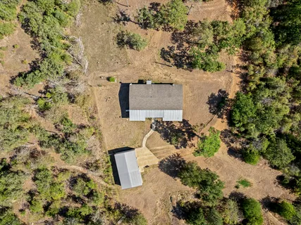 an aerial view of residential house with outdoor space