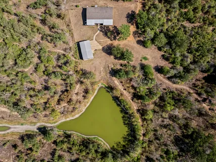 an aerial view of residential house with outdoor space