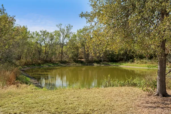 a view of a lake with a yard