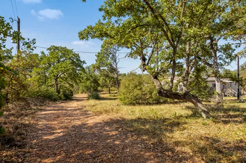 a view of a lake with houses in the back