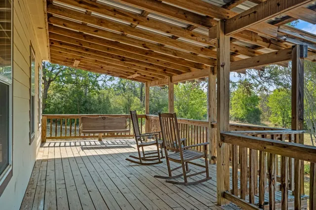 a view of a two chairs on the deck